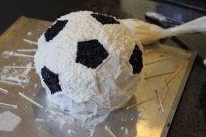 Icing the Soccer Ball Cake